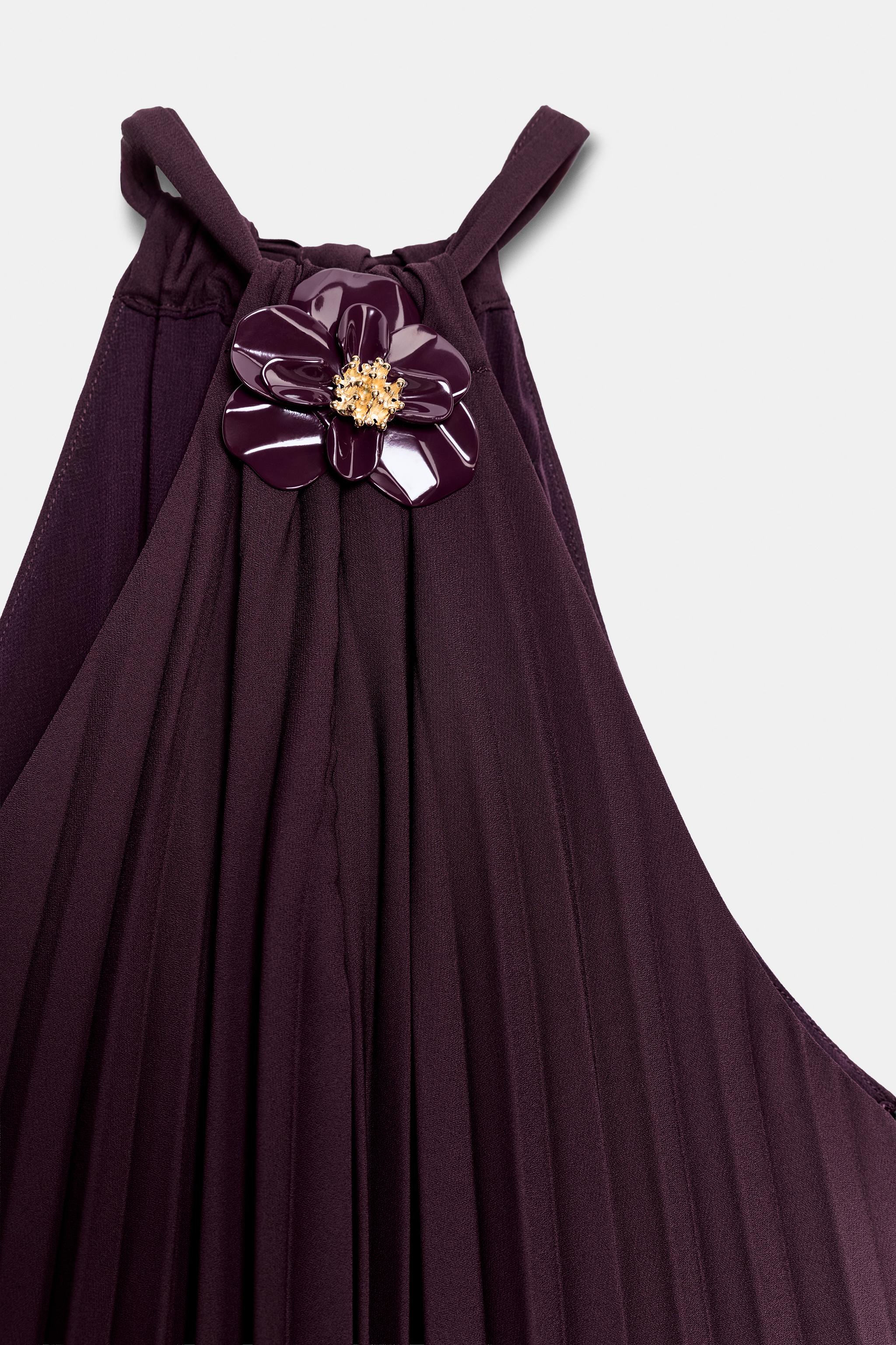 PLEATED MIDI DRESS WITH FLORAL BROOCH